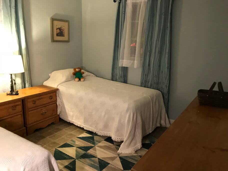 This bedroom has twin beds