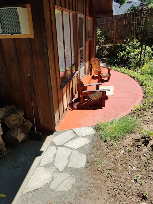 Paved welcome to the private patio on the west non street side. June 2017