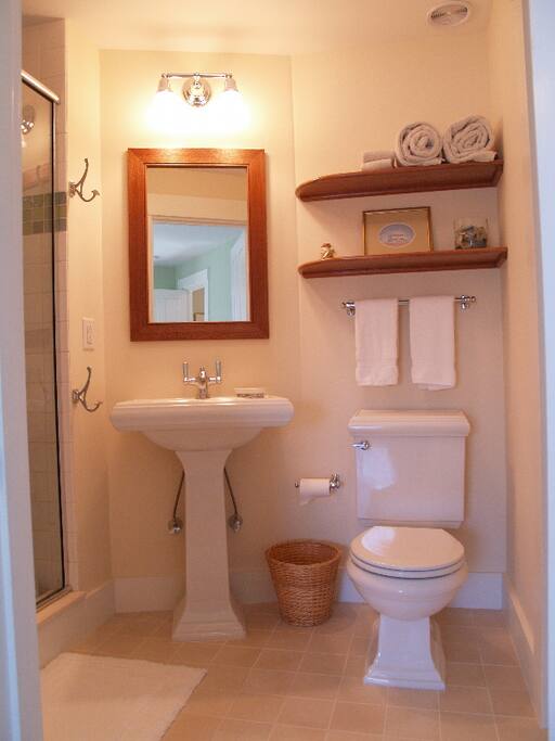 The en suite bathroom, also a Hutchison design, has a tiled shower and plenty of towel space. Edgartown, Martha's Vineyard.