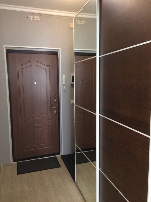 Hall with large wardrobe and intercom