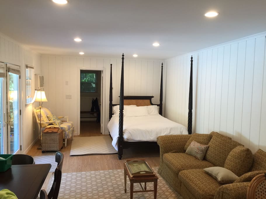 Pool house is a studio layout with a queen poster bed and kitchenette
