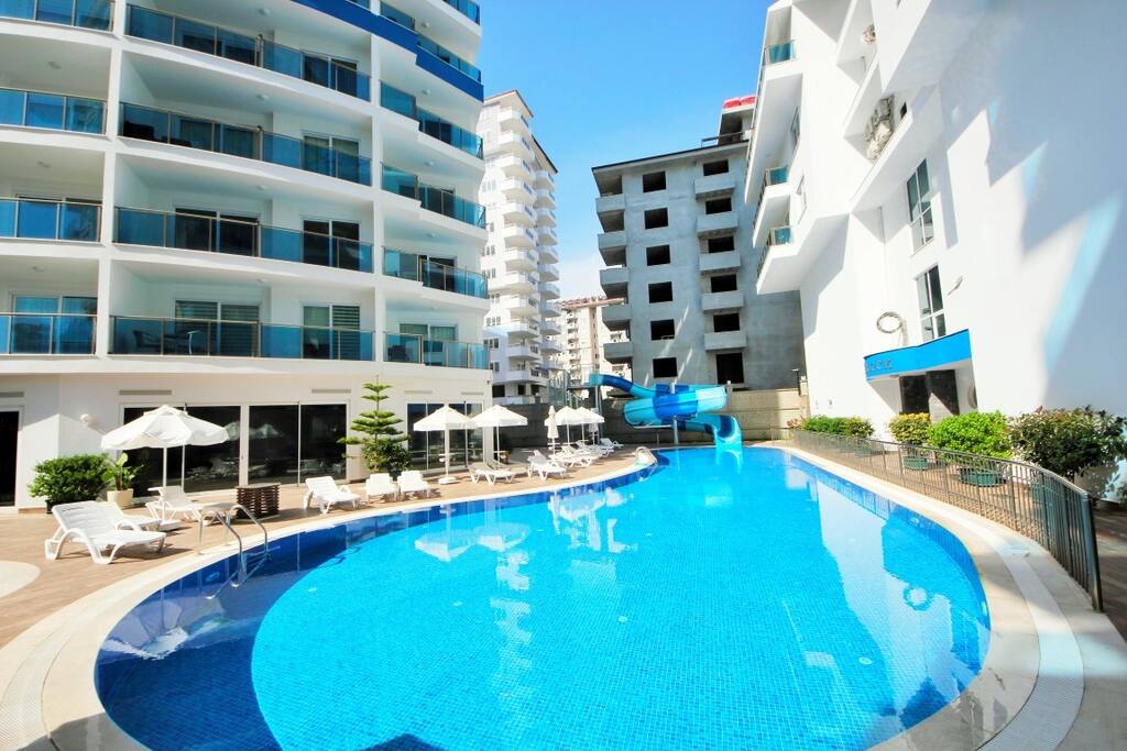 big pool with sun beds