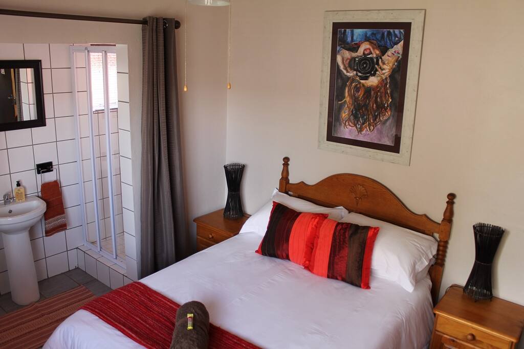 Bedroom with double bed and en-suite bathroom