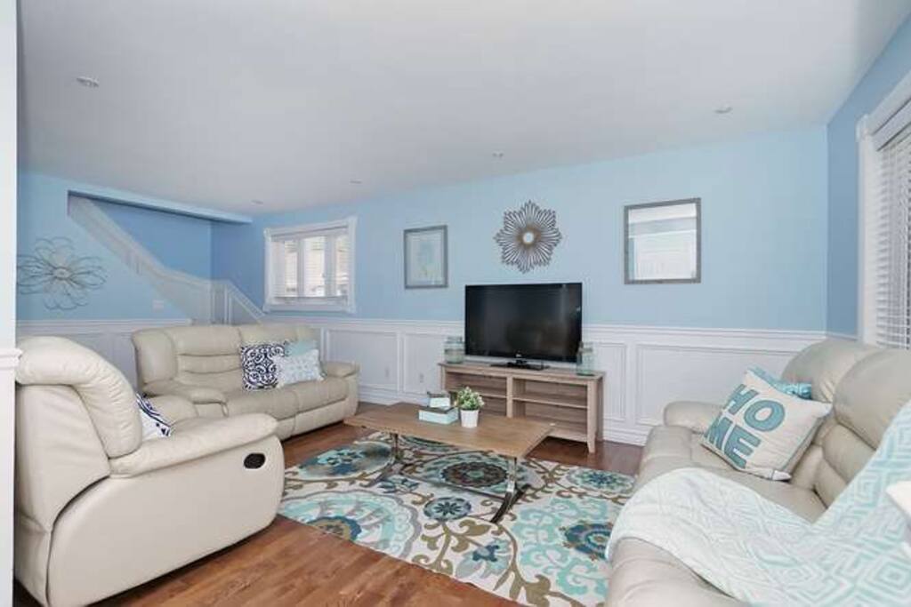 Living/ Tv room with cable tv and comfy Lazy boy couches