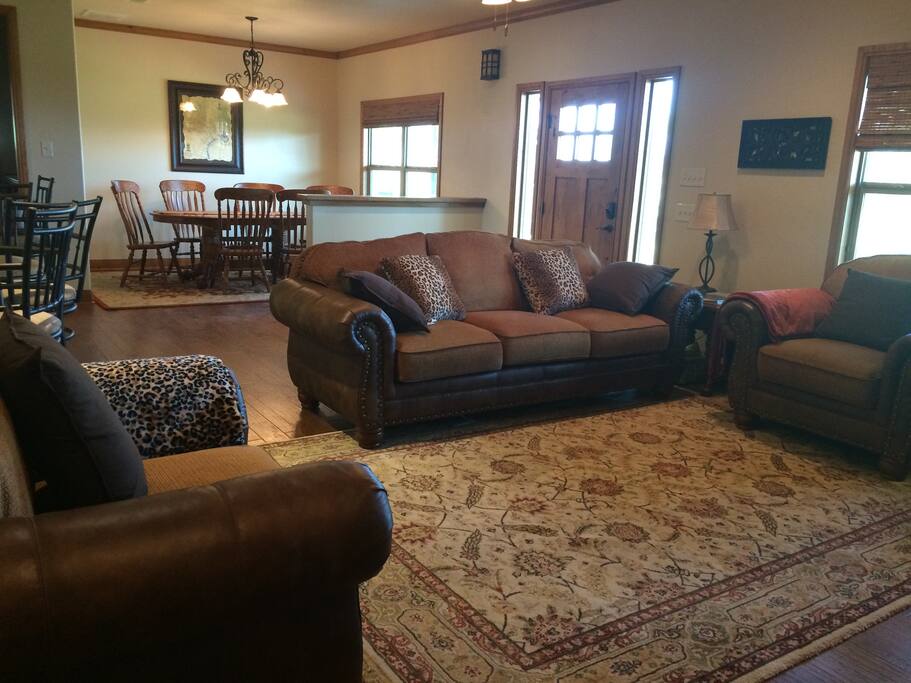Comfy living room with large television will seat 6.