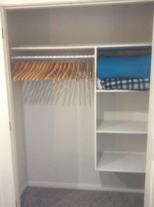 Double Wardrobe with coat hangers and spare blankets