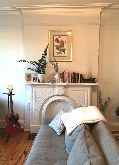 Living room w/ couch, TV, dining table