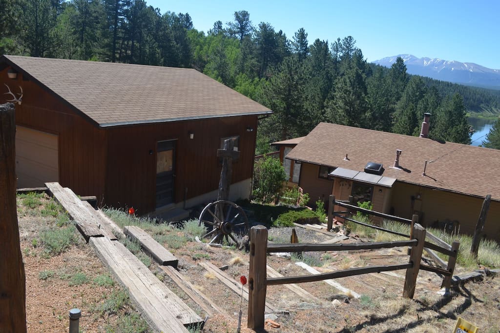 This cabin is nestled in the mountain side.