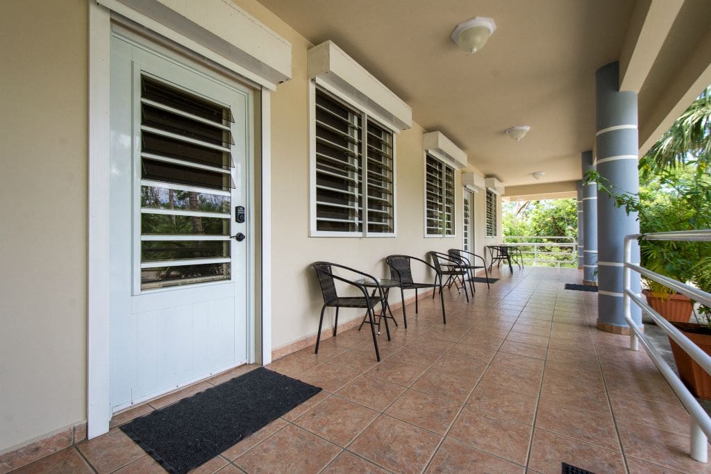 Shared Common Area & Entry - Both apartments have 4 chairs, a coffee table and a breakfast table on the front porch. Doors are locked via keypad.