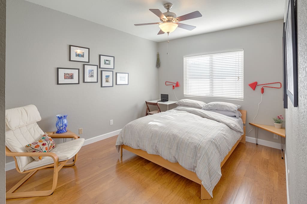 Queen Bed with comfy pillowtop mattress and work desk in corner with reading chair
