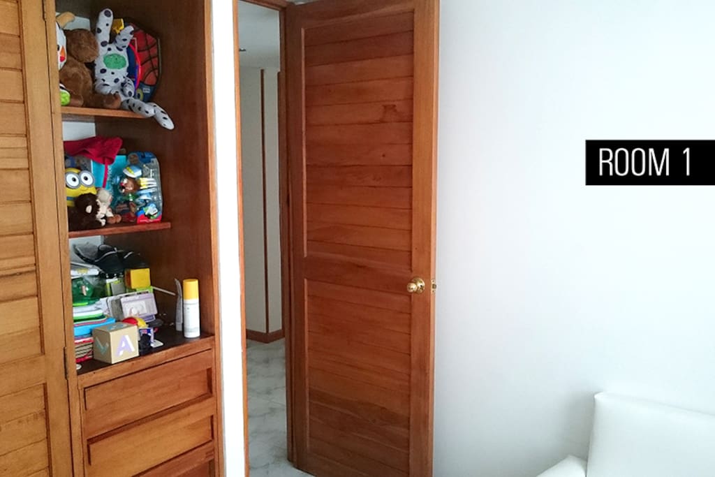 One single size bed, a lot of light from the window. The room has a small cabinet too.