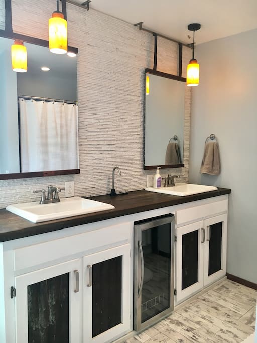 Shared master bathroom with shower and tub.