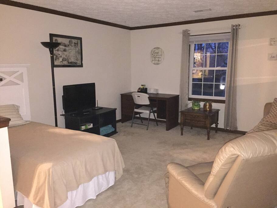 spacious living area with extra twin bed