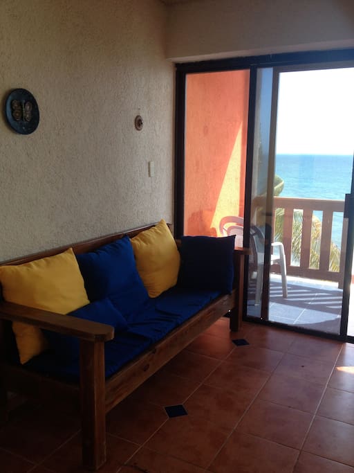classic mexican furniture with new comfy pillows and amazing view of the sea