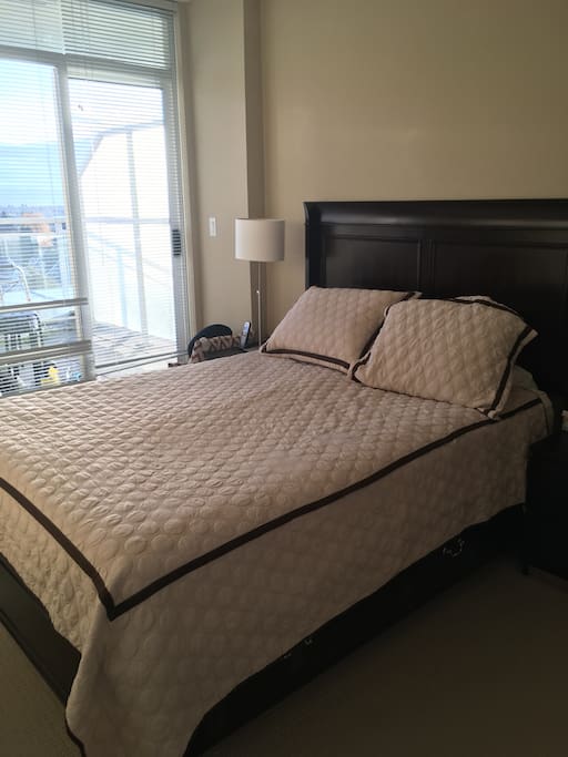 Master bedroom overlooking views of mountain, downtown. Entrance also to the patio where you can see north, west and east of Vancouver.