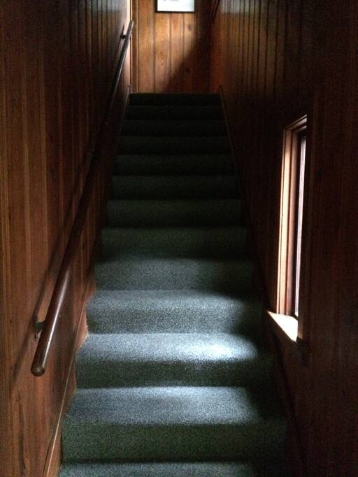 Stairs inside front door leading to upstairs Unit B.