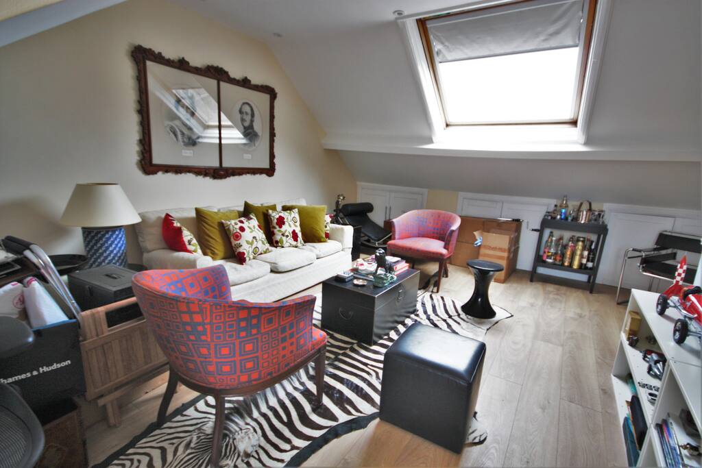 Charming loft sitting room with Velux window and access to terrace