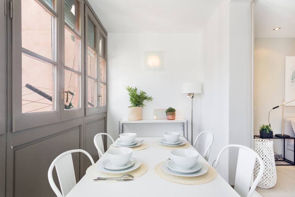 Enclosed balcony which is used as dining area