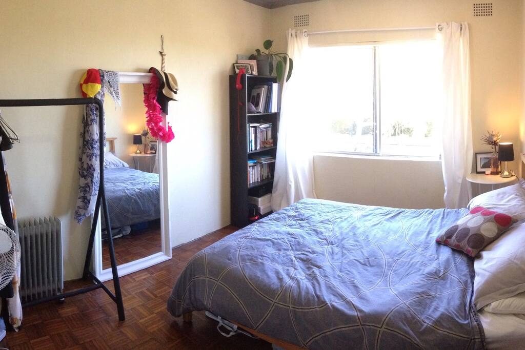 The bedroom is has a comfy queen bed, fan and heater.