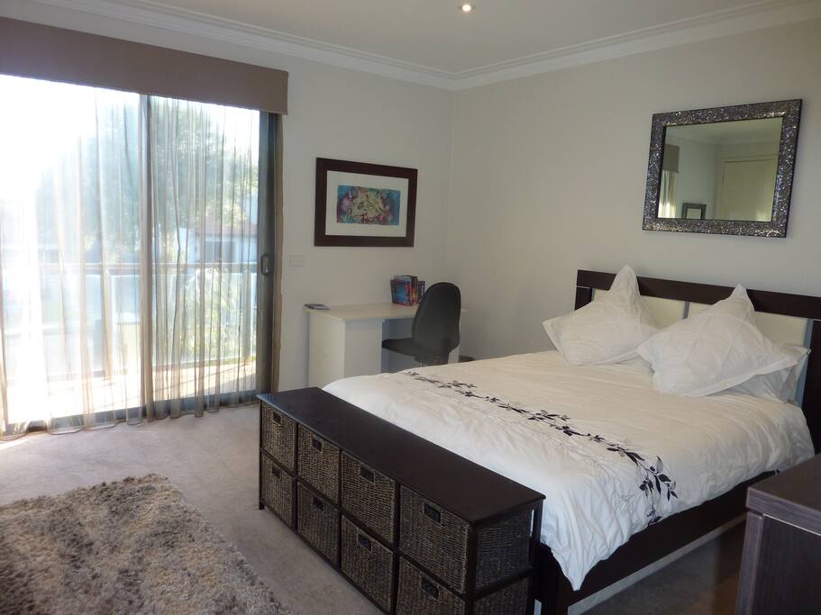 double bedroom with desk. large wardrobe space, balcony