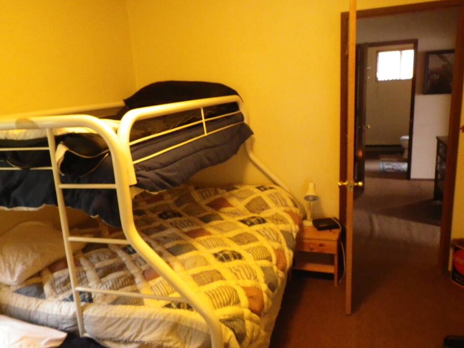 Bedroom with double and two single beds