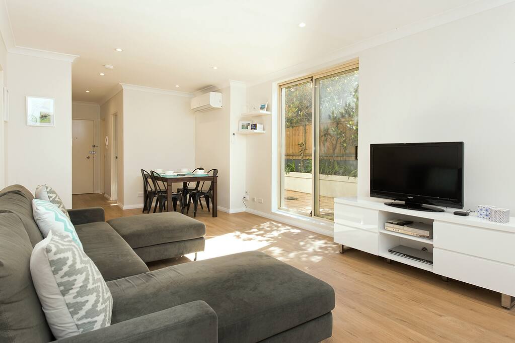 Living and dinning space looking out to the outdoor terrace