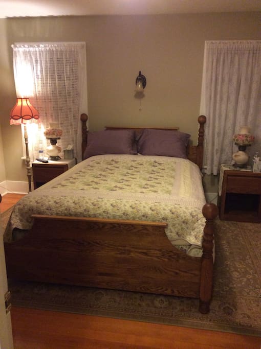 Large room decorated in the 1930s era. Original hardwood floors restored to their beautiful luster.