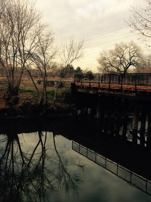 Just in front of the house, the Jordan River and train track bridge to some City wetlands. Tons of Canadian Geese hang out near the home.