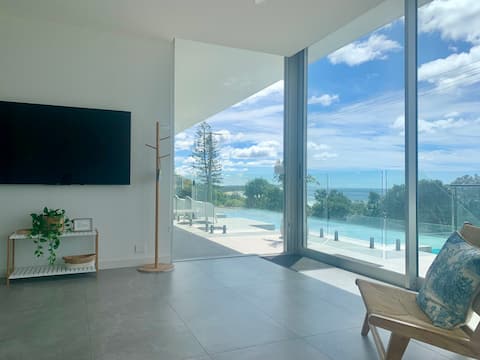 Top Airbnb: Unwind Beachfront 2BR suite with own pool. Views! in Coolum Beach