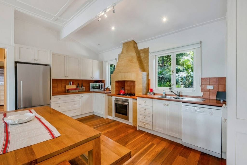 The entertainers delight eat-in kitchen featuring Timber & Stainless Steel