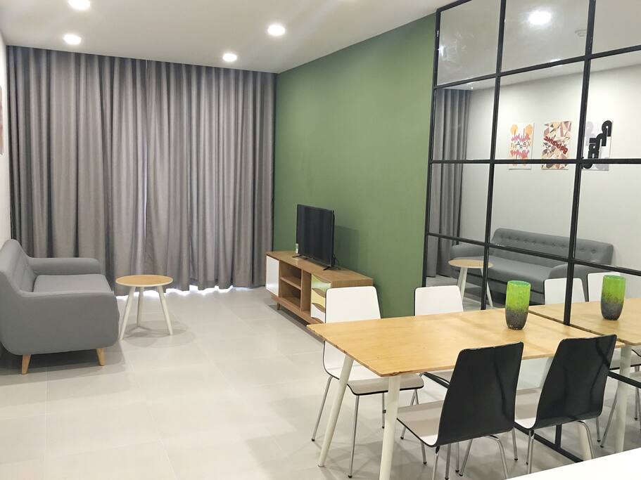Bright and spacious living area. The sofa can be used as a bed.