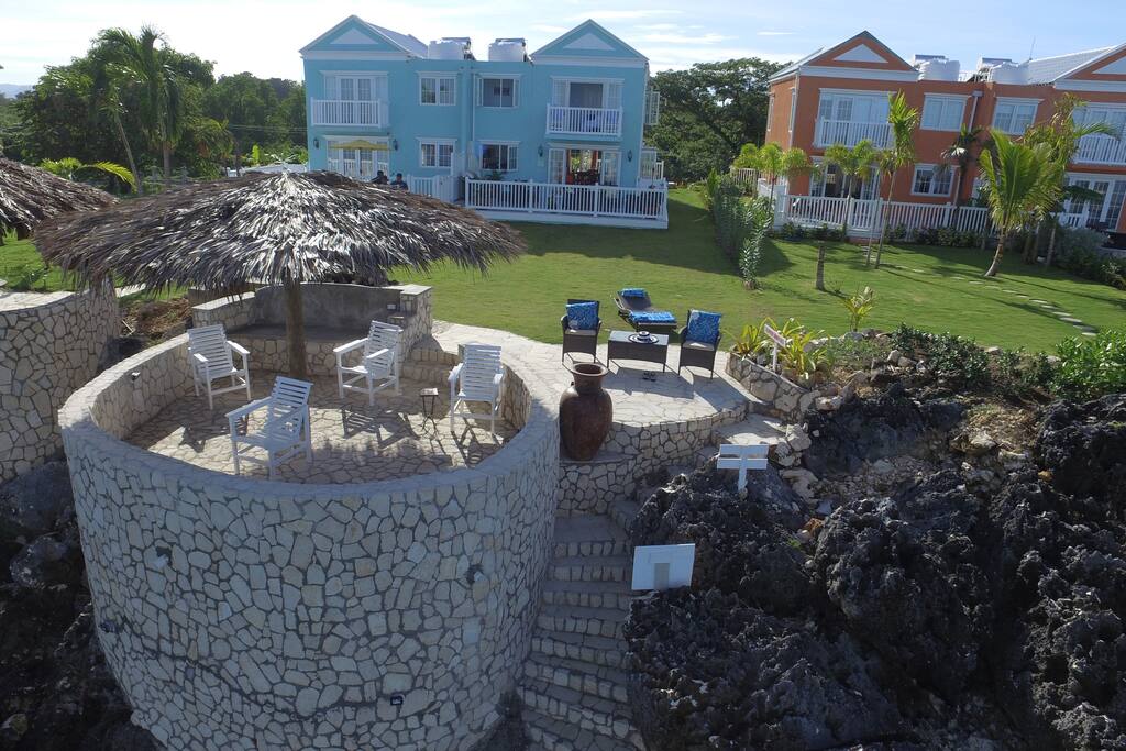Our beautiful townhouse with its lovely green space, patio seating and direct access to the water below