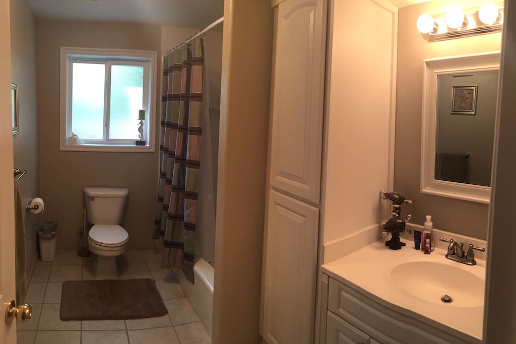 Private full bath with tub/shower combo located next to private bedroom