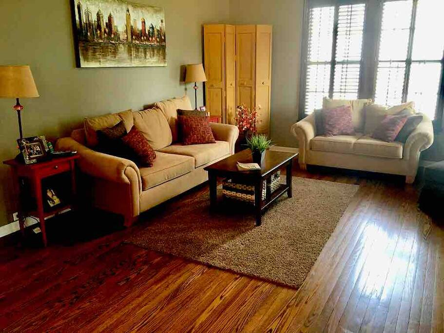 Formal living room with gas log fireplace off of formal dining room