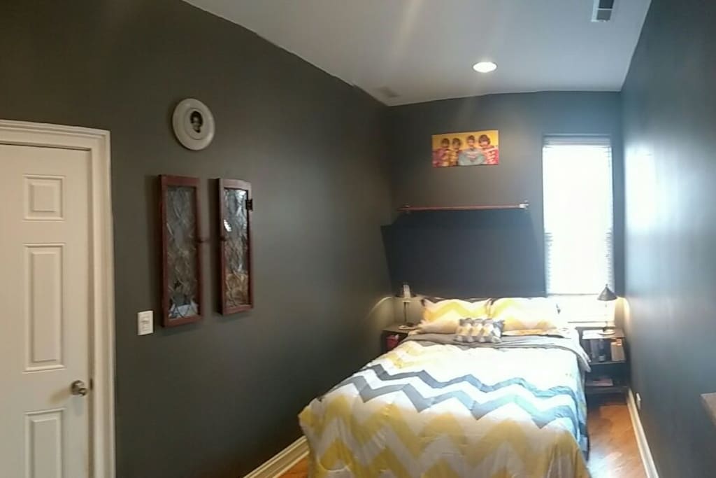 Bed for two with bedside lamps.