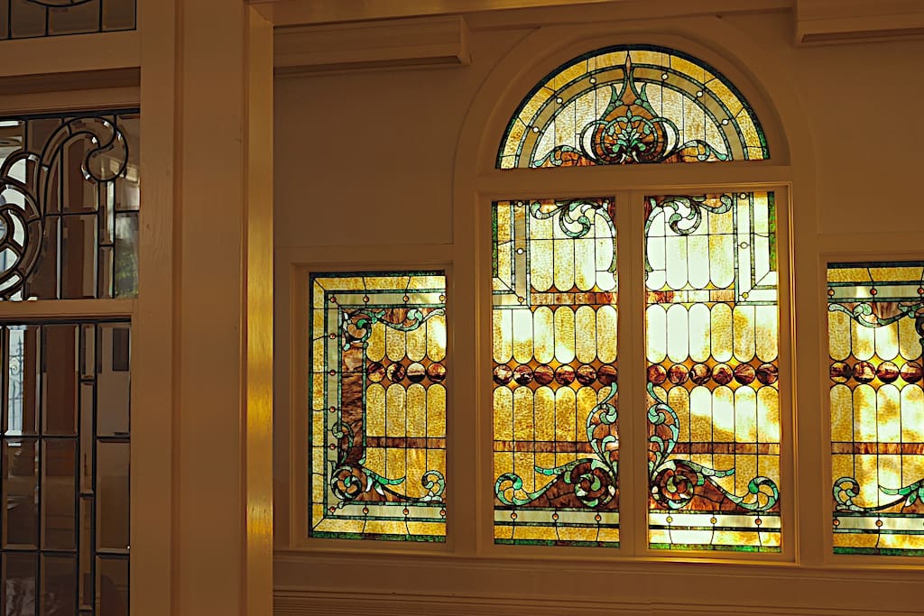 Stained and leaded glass greet you when you walk in.
