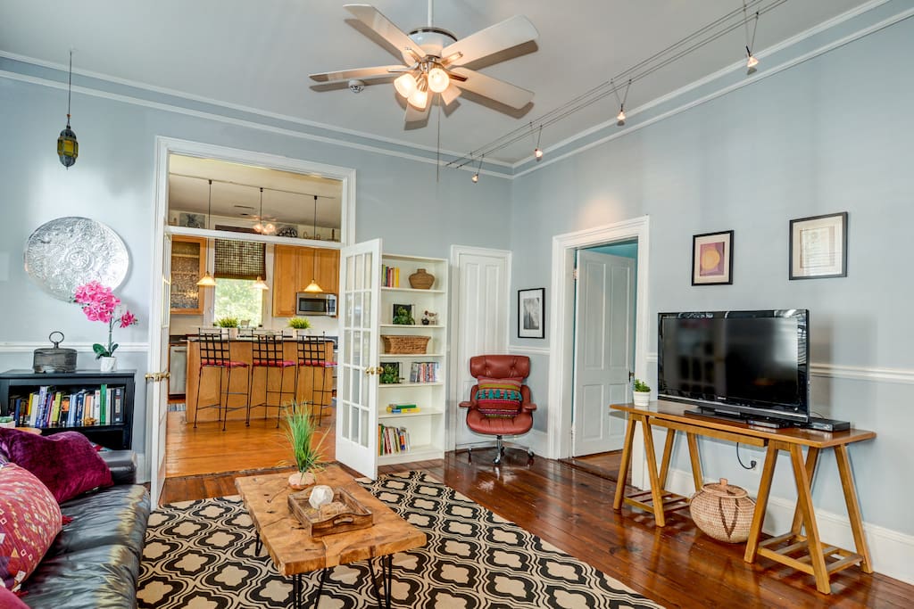 This spacious home (very rare for Charleston to have this much sq. footage) has an open floor plan throughout, so you and the other guest can relax in comfort without being cramped! Here is your living room with an Eames Chair and Direct TV!