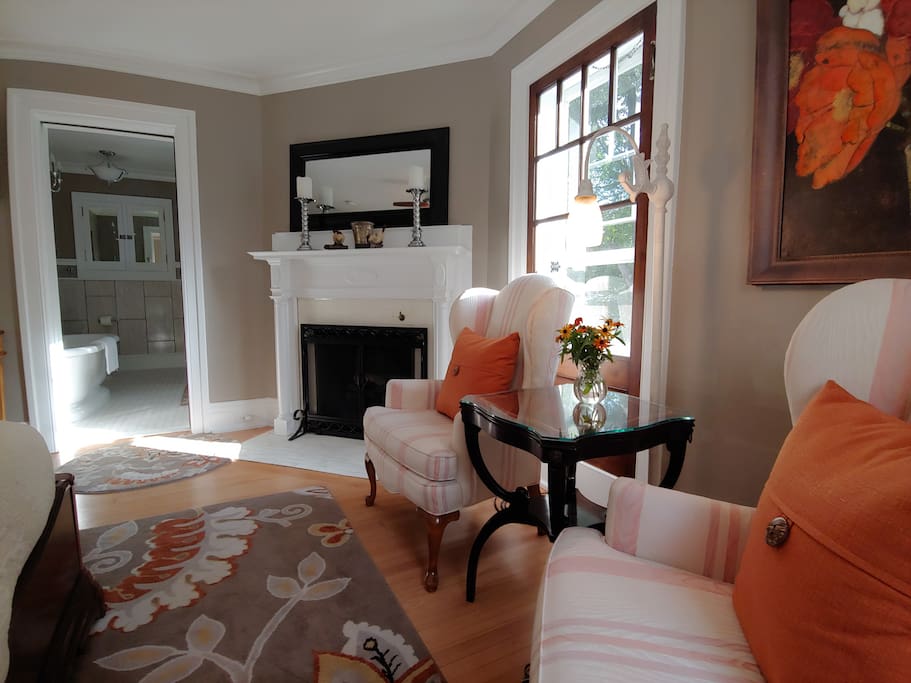 Sparrow sets the mood with the realistic flames of the faux electric log set in the Original Corner Fireplace