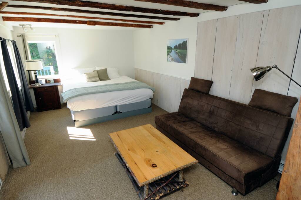The Annex Suite has a king bed, sitting area, private 4 piece bath, mini-fridge, microwave oven, and private deck overlooking the Northumberland Strait.