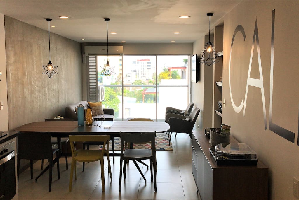 Large open space with flow from kitchen to open air balcony