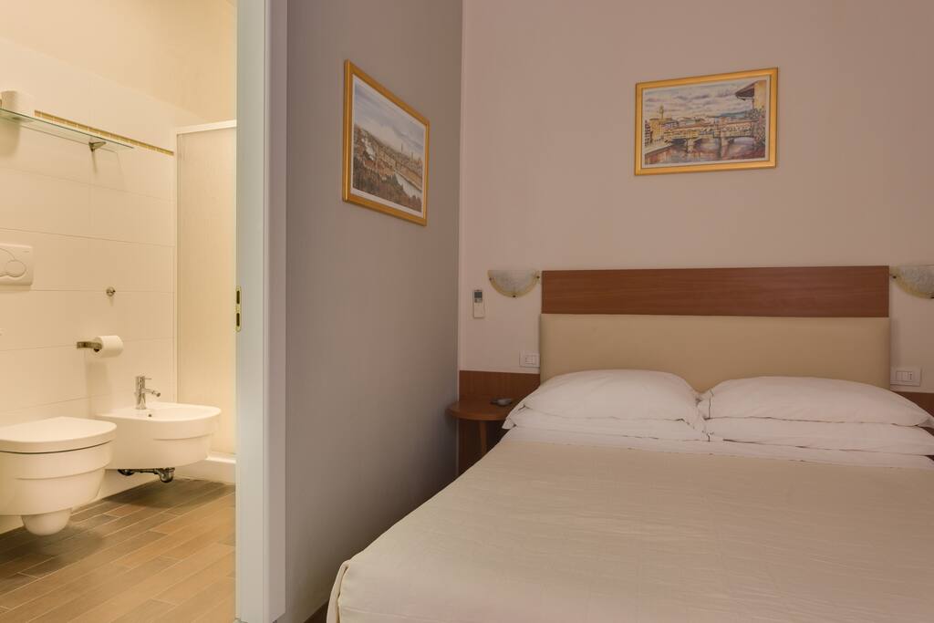 double bed or twin on request, and the bathroom