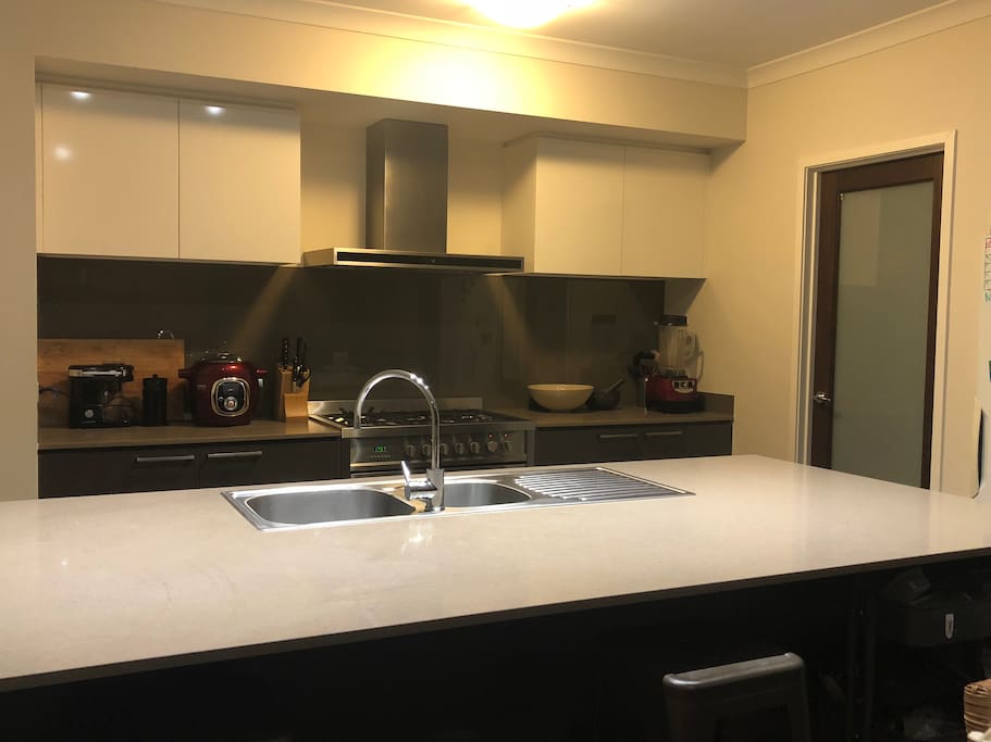 Large kitchen with walk in pantry, large stainless steel oven and cook top with wok burner. Dishwasher are appliances. Just feel at home! - Note: there is no microwave oven.