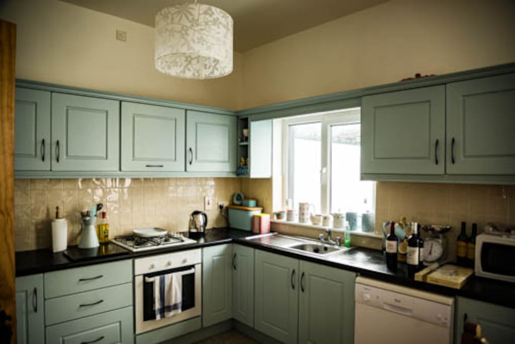 Large, bright kitchen with Fridge/Freezer, cooker and hob and microwave.