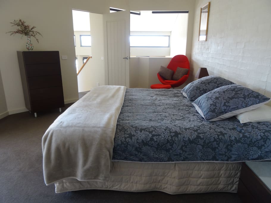 Main bedroom, own deck, views to lagoon and garden