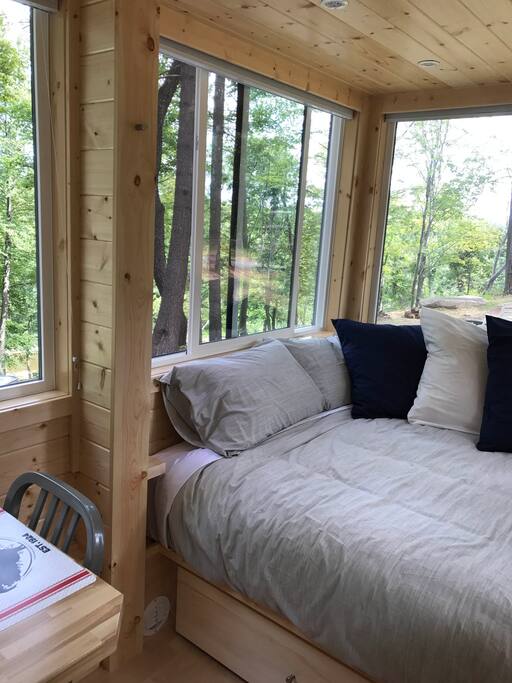 Queen Bed with Walls of Window, Blinds as Well