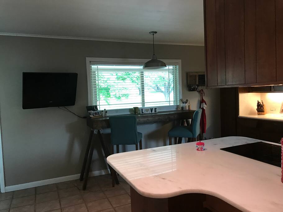 Kitchen with extra TV.
