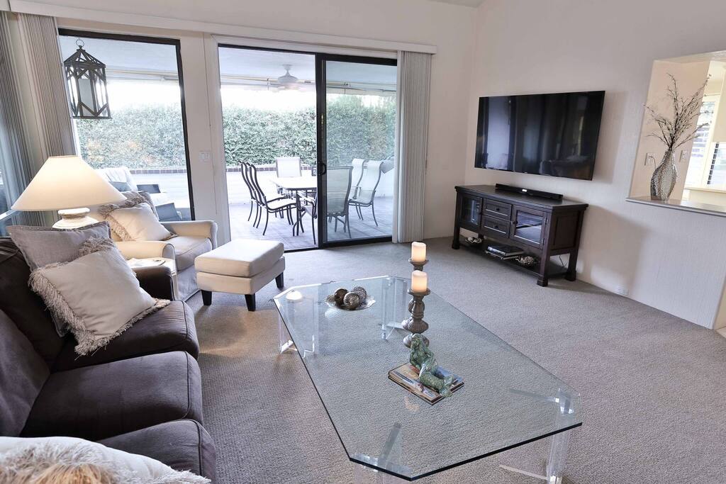The living room opens up to the patio, creating a beautiful and free flowing space for entertaining guests.