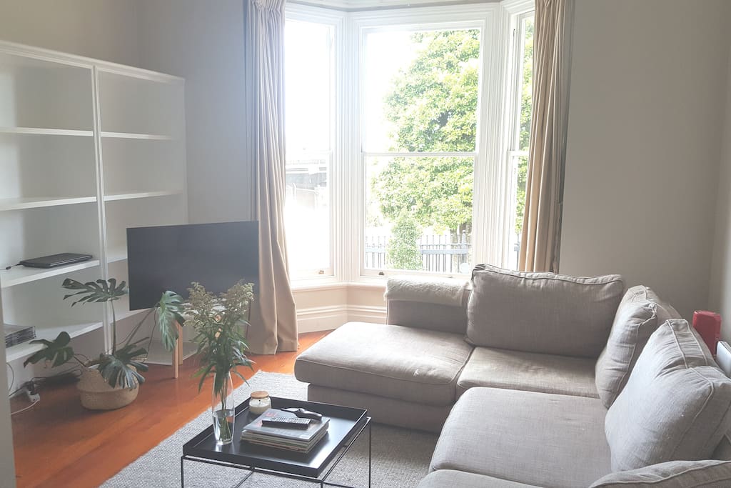 Main living with huge bay window and 12 foot stud