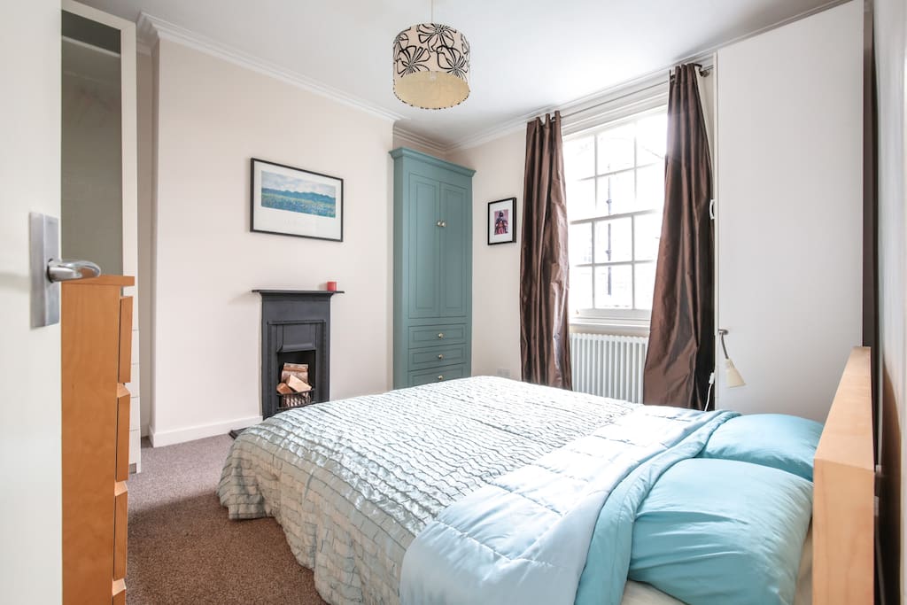 Large double bedroom with view out over garden at rear.