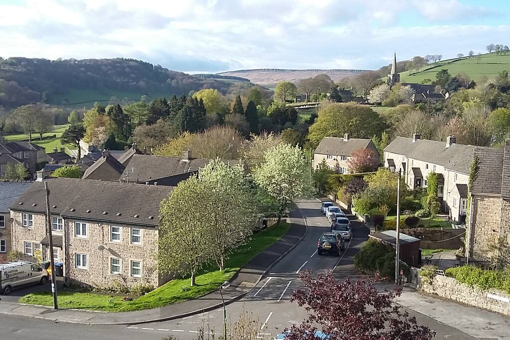 View from our house to the church & Stanage Edge